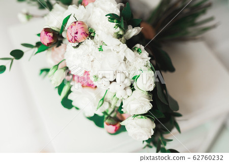 Beautiful wedding bouquet with different flowers, roses Beautiful wedding bouquet with different flowers, roses 62760232