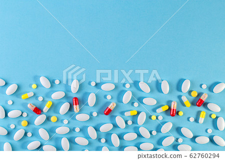 Medical background. Multi colored pills pattern on Medical background. Multi colored pills pattern on 62760294