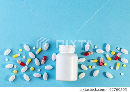 White bottle and different medicines in tablets White bottle and different medicines in tablets 62760295