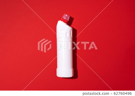 White plastic bottle of cleaning product, household chemicals or liquid laundry detergent on red background. Top view. Flat lay. Copy space. Detergent bottle White plastic bottle of cleaning product, household chemicals or liquid laundry detergent on red background. Top view. Flat lay. Copy space. Detergent bottle 62760496