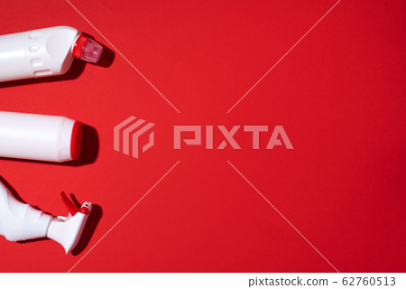 Cleaning products pattern on red background. Top view. Copy space. Chemical cleaning supplies. Stop plastic, recycling, separate collection of garbage concept 62760513