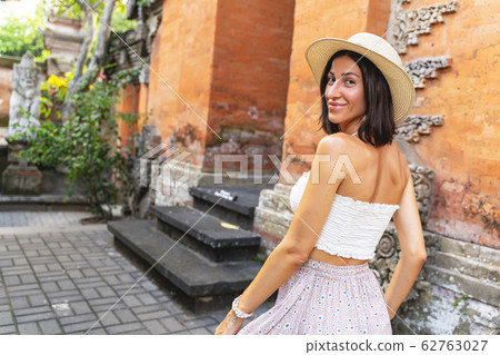 Cheerful girl enjoying exotic architecture stock photo Cheerful girl enjoying exotic architecture stock photo 62763027