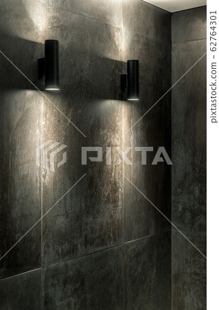 Luminous black lamps on tiled wall indoors Luminous black lamps on tiled wall indoors 62764301