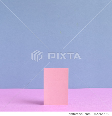 Pink memo paper, sticky notes on pink and purple background 62764389