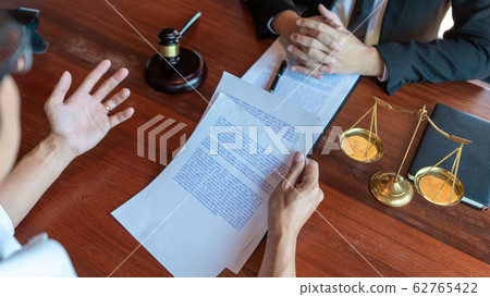 Lawyer working with client discussing contract 62765422