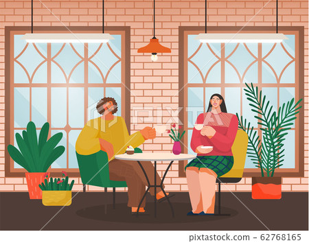 Eating Out, Couple in Cafe Drinks Coffee at Table 62768165