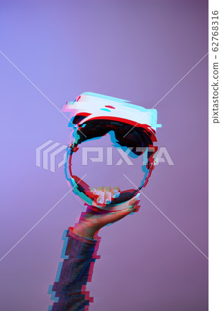 Hand with virtual reality headset. Technology of future. Image with glitch effect. Hand with virtual reality headset. Technology of future. Image with glitch effect. 62768316