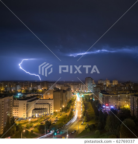 BELARUS, MINSK - MAY, 2019: Photo of the lightning striking in suburbs at spring night BELARUS, MINSK - MAY, 2019: Photo of the lightning striking in suburbs at spring night 62769337