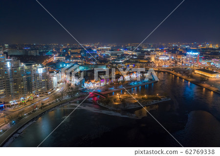 BELARUS, MINSK - JANUARY, 2020: Aerial drone photo of the Minsk city centre at night. BELARUS, MINSK - JANUARY, 2020: Aerial drone photo of the Minsk city centre at night. 62769338