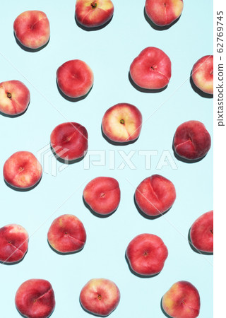 Peaches pattern on pastel blue background. Frame made of fresh fruits. Flat lay, top view, copy space. Vegan and vegetarian diet 62769745