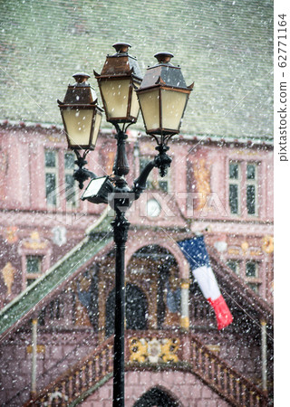 view of retro street lamp with old city hall  62771164