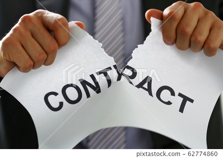 White collar worker in suit and tie tear contract 62774860