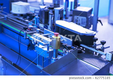 pharmaceutical industry. Production line machine conveyor at factory with bottles 62775185