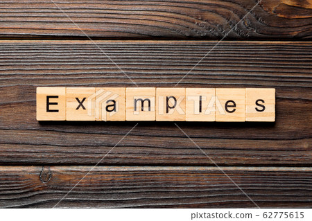 examples word written on wood block. examples text 62775615