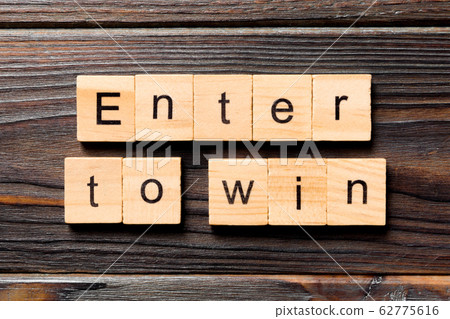 Enter To Win word written on wood block. Enter To Enter To Win word written on wood block. Enter To 62775616