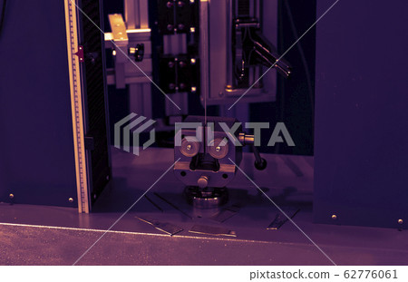 Worker cutting metal with cutting machine 62776061