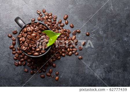 Coffee cup with roasted beans Coffee cup with roasted beans 62777439
