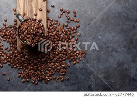 Coffee cup with roasted beans 62777440