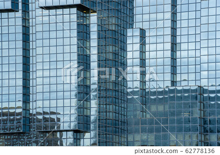 A fragment of the steel and glass modern building structure A fragment of the steel and glass modern building structure 62778136