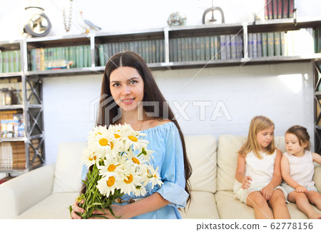Little girl giving bouquet of beautiful flowers to Little girl giving bouquet of beautiful flowers to 62778156