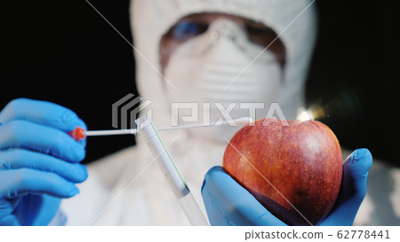 The scientist shoots a sample in the big apple. Food quality study 62778441