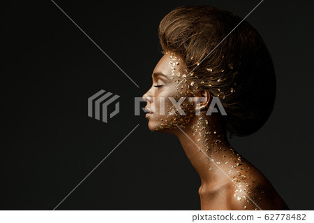 model girl with holiday golden shiny professional makeup. model girl with holiday golden shiny professional makeup. 62778482