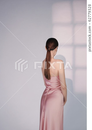 Beautiful woman pose in studio in pink classic Beautiful woman pose in studio in pink classic 62779328