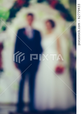 Newlyweds on their wedding day, blur Newlyweds on their wedding day, blur 62779433