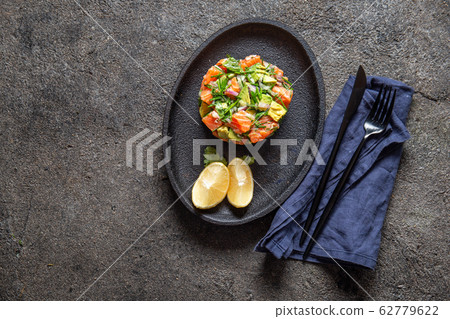 PERUVIAN NIKKEI FOOD. Salmon avocado ceviche on 62779622