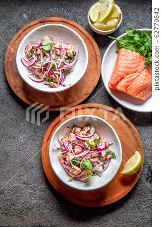 CHILEAN SALMON SEVICHE. Fresh raw salmon marinaded CHILEAN SALMON SEVICHE. Fresh raw salmon marinaded 62779642