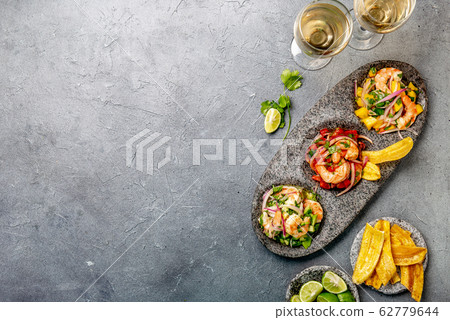 CEVICHE. Three colorful shrimps ceviche with 62779644
