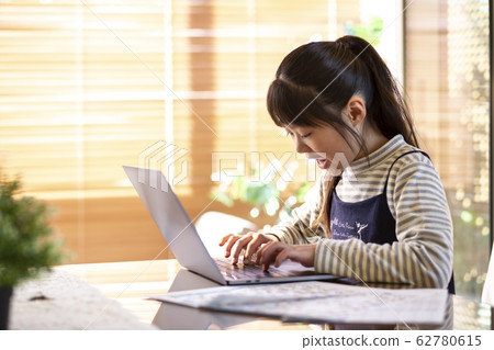 Elementary school girl typing 62780615
