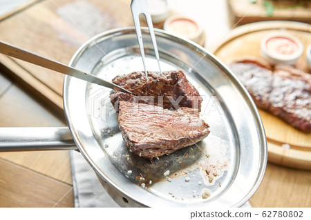 Various grilled meat set with Pickled cabbage and two sauces. Serving on a wooden Board. Barbecue restaurant menu, a series of photos of different meats. Various grilled meat set with Pickled cabbage and two sauces. Serving on a wooden Board. Barbecue restaurant menu, a series of photos of different meats. 62780802