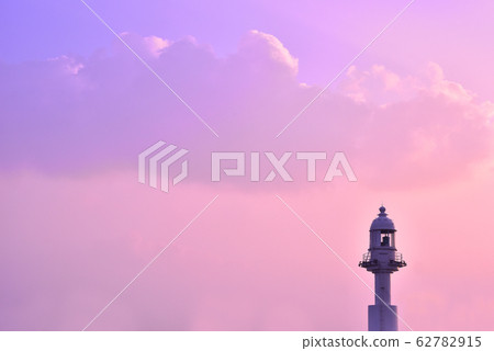 Under the purple-colored sky at dusk and a small lighthouse Under the purple-colored sky at dusk and a small lighthouse 62782915