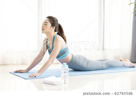 Women stretching yoga 62783586