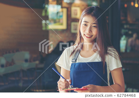 Barista asian young woman Cafe Making Coffee Preparation. 62784468