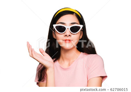 Young beautiful asian woman,long black hair Wearing a pink t-shirt, White fashion glasses, Yellow hair band smiling and Surprised isolated on white background 62786015