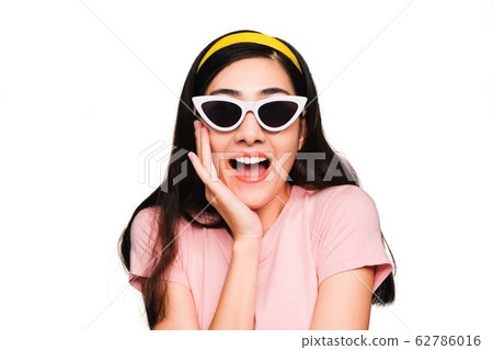 Young beautiful asian woman,long black hair Wearing a pink t-shirt, White fashion glasses, Yellow hair band smiling and Surprised isolated on white background 62786016