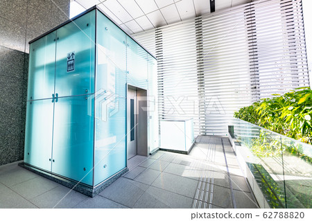A glass elevator that leads to the pedestrian deck of Sendai Forest 62788820