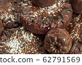 Background of homemade chocolate sweets. Natural chocolate candies. Coconut raisin cookies. Top view. Selective focus. Healthy and delicious meal. Harmless treat to tea for vegan and vegetarian diet 62791569