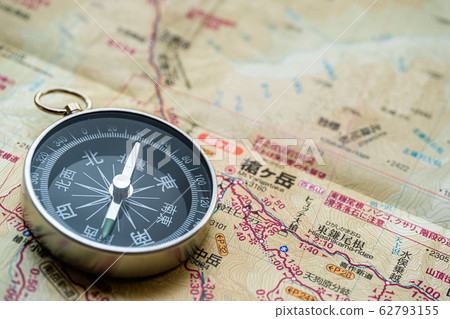 Compass and mountain map 62793155