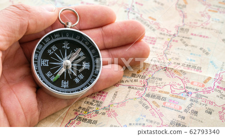 Compass and mountain map 62793340