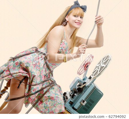 sexy pin-up girl with film reel and vintage 62794092