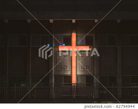 The symbol of the Christian cross is on the roof The symbol of the Christian cross is on the roof 62794944