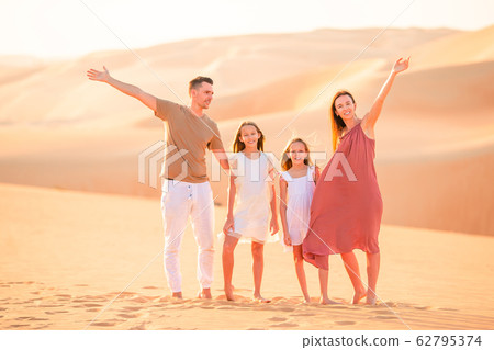 People among dunes in Rub al-Khali desert in United Arab Emirates People among dunes in Rub al-Khali desert in United Arab Emirates 62795374
