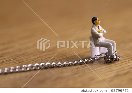 Businessman chained Businessman chained 62796771
