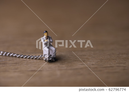 Businessman chained Businessman chained 62796774
