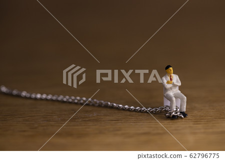 Businessman chained Businessman chained 62796775