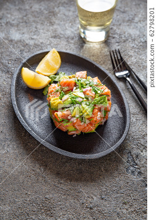 PERUVIAN NIKKEI FOOD. Salmon avocado ceviche on PERUVIAN NIKKEI FOOD. Salmon avocado ceviche on 62798201