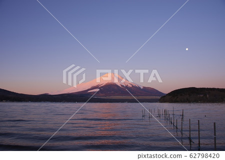 Red Fuji (winter) at dawn as seen from Lake Yamanaka (near the plains) Red Fuji (winter) at dawn as seen from Lake Yamanaka (near the plains) 62798420